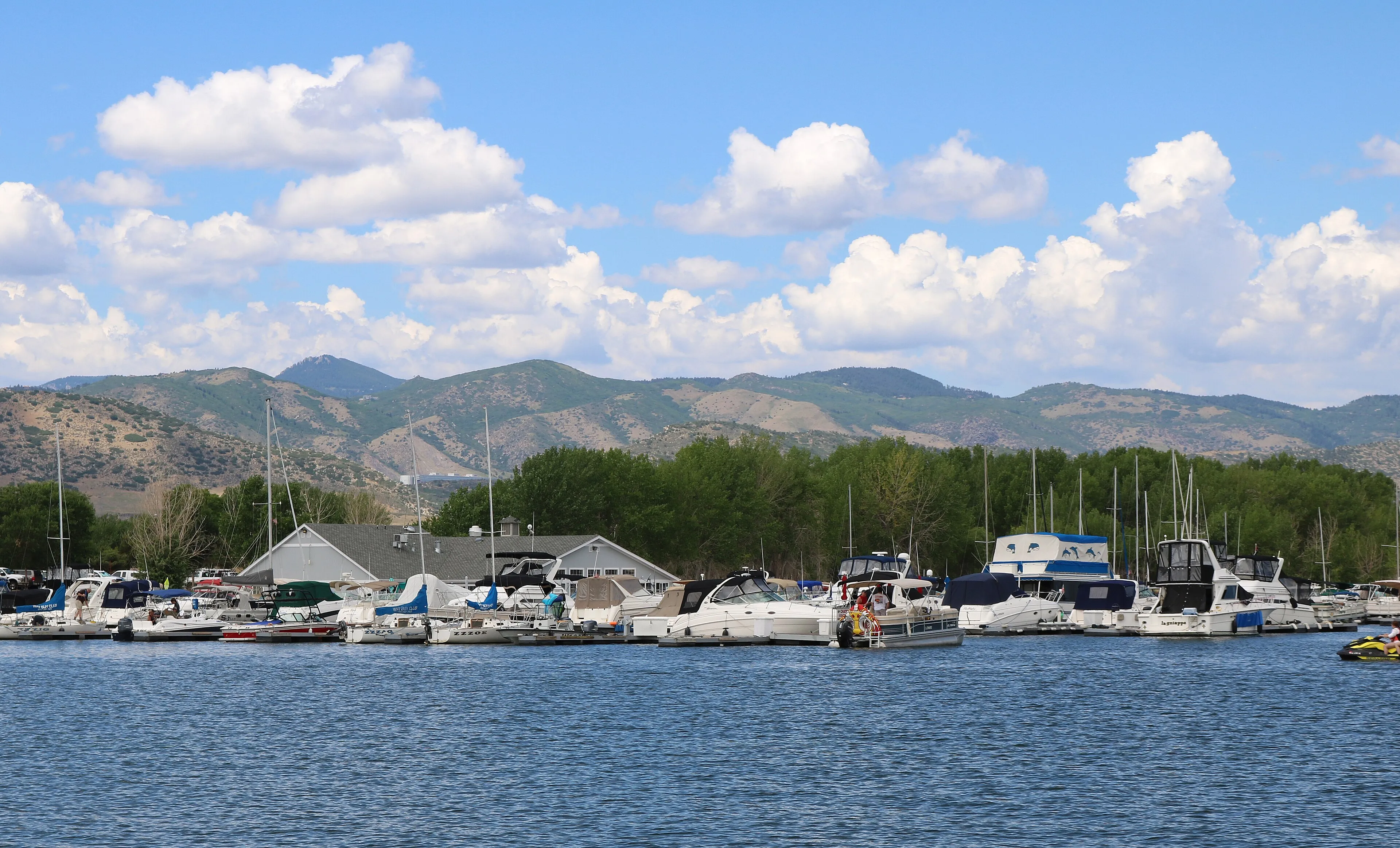 Boats moored at Chatfield Marina with the foothills rising behind the reservoir, Littleton, Colorado